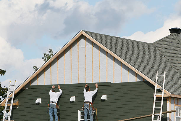 Professional Siding Installation technician working in Melville, NY